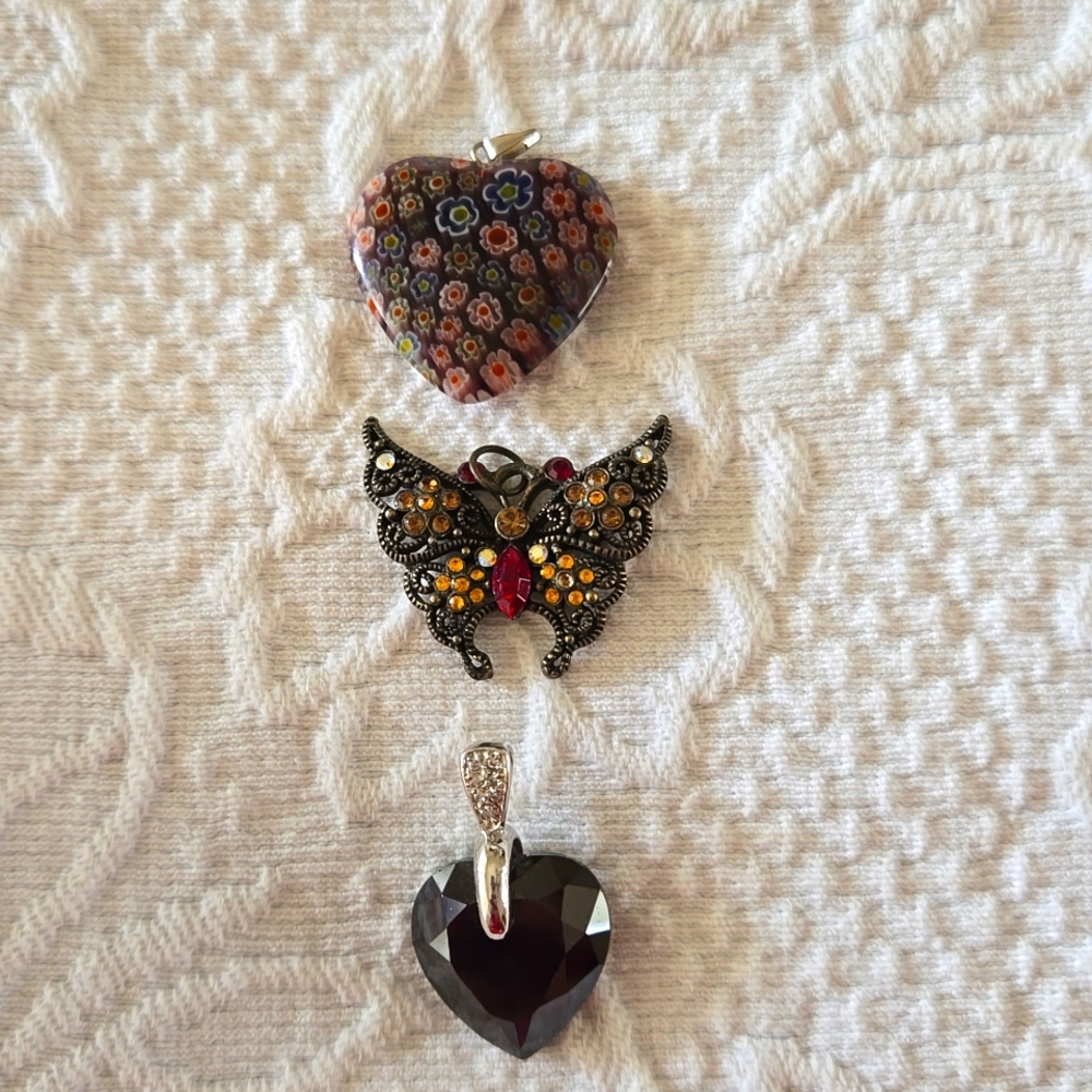 Three necklace pendants